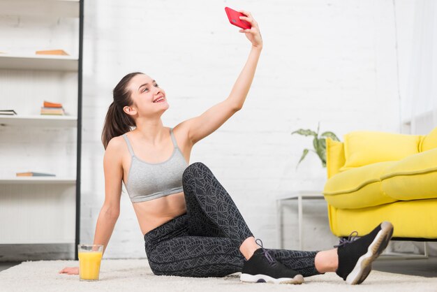 Fitness girl taking a selfie