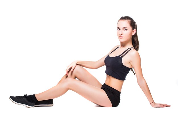 Fitness woman doing stretching exercise isolated on white background