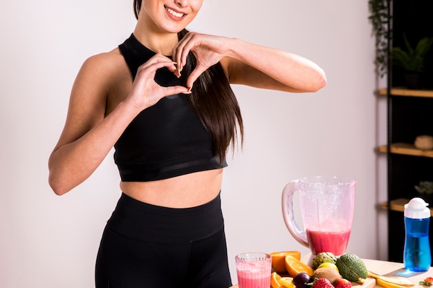 Fitness woman preparing a detox juice