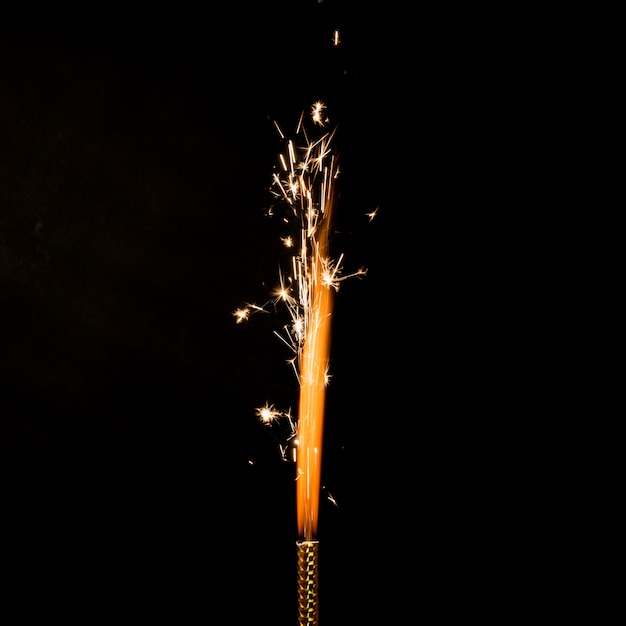 Free photo flame with sparkles on black background