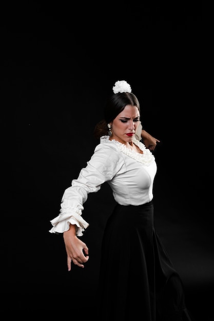 Free Photo flamenca dancer performing with black background