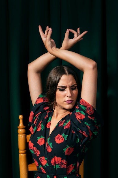 Flamenca dancer raising hands up