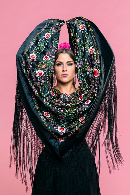 Flamenca dancer with manila shawl looking at camera