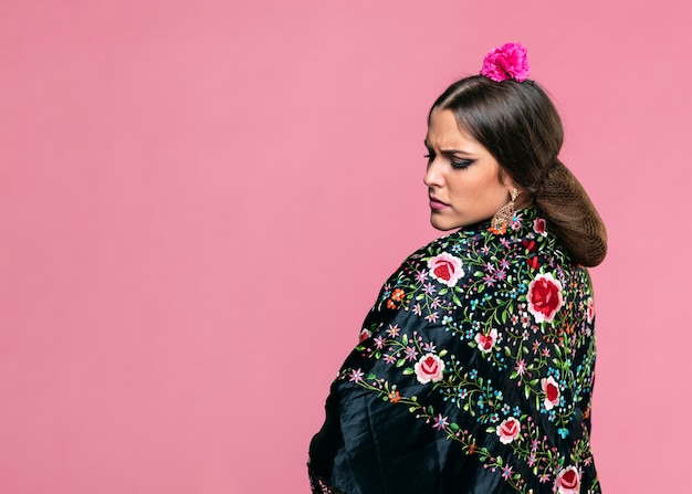 Free photo flamenca wearing manila shawl with pink background