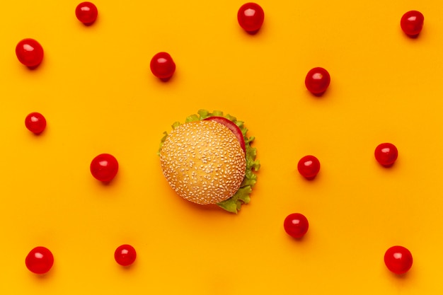 Free Photo flat lat burger with cherry tomatoes