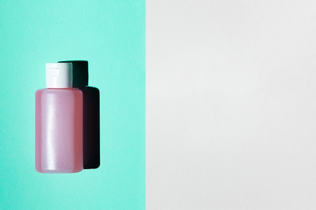 Free photo flat lay of acetone bottle with copy space