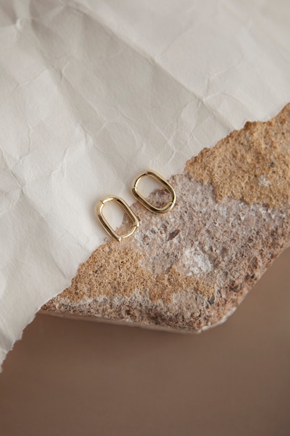 Flat lay aesthetic golden earrings arrangement