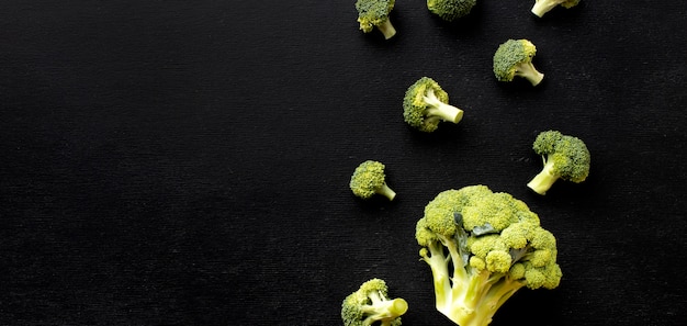 Flat lay arrangement of delicious fresh broccoli with copy space