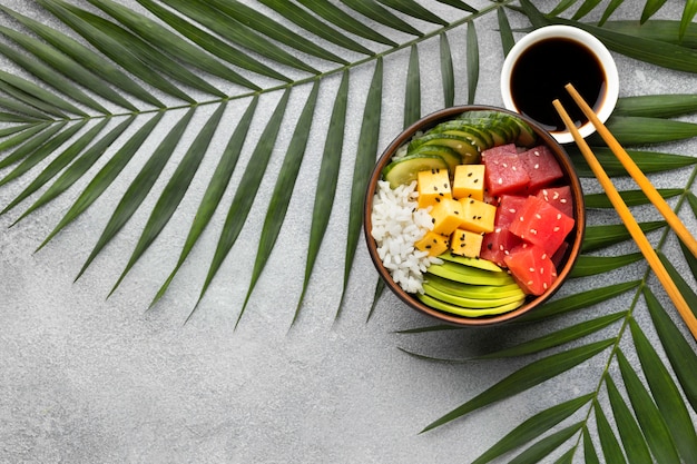 Free photo flat lay arrangement of delicious poke bowl