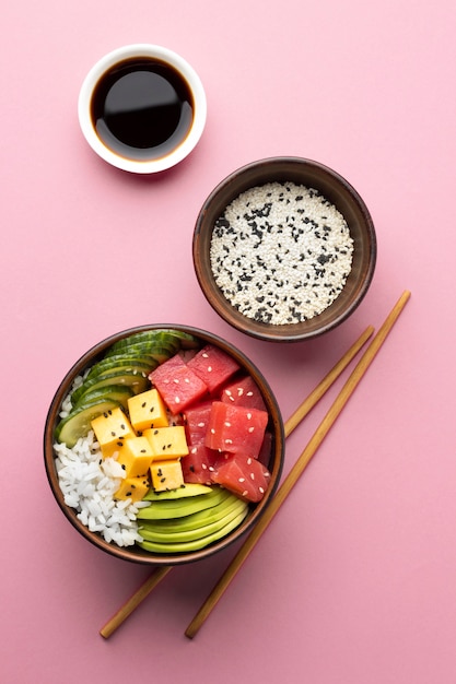 Flat lay arrangement of delicious poke bowl