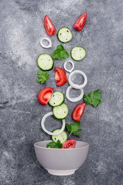 Flat lay arrangement of different ingredients on cement background