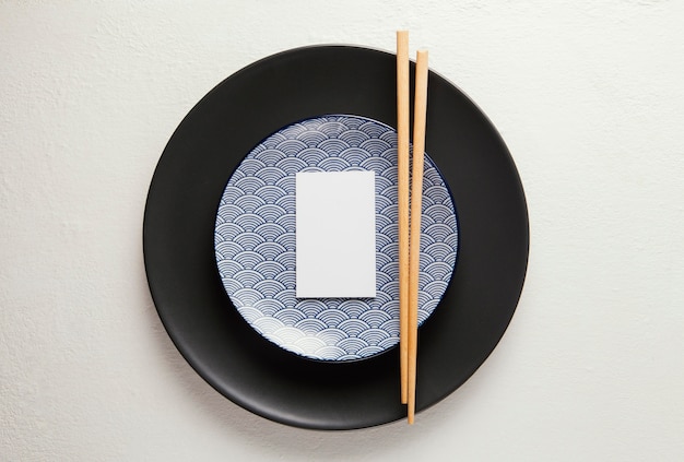 Flat lay arrangement of elegant tableware with smartphone