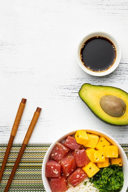 Flat lay arrangement of hawaiian poke bowl