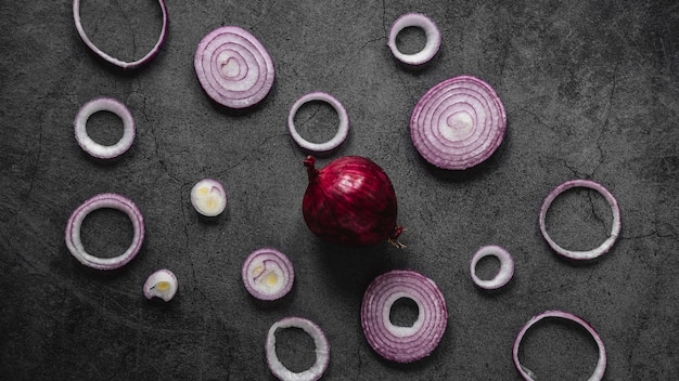 Free Photo flat lay arrangement of red onion rings