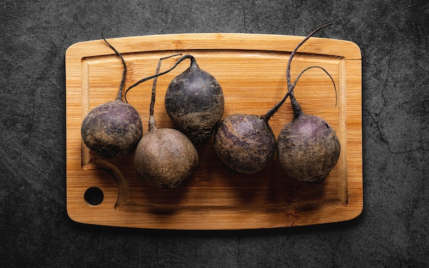 Free photo flat lay arrangement of veggies on wooden board