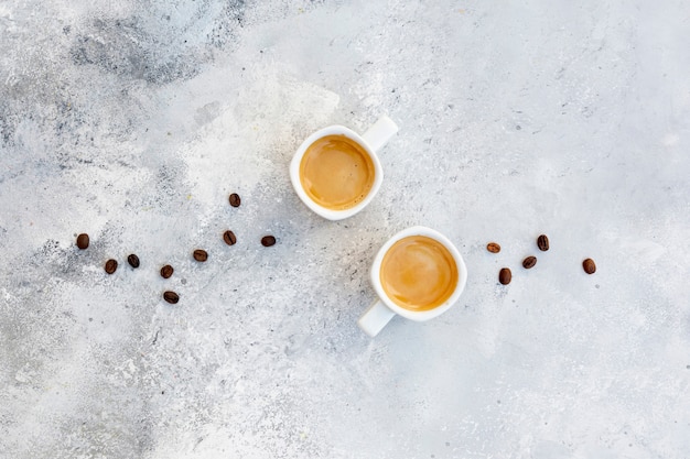 Flat lay arrangement with cappuccino on stucco background