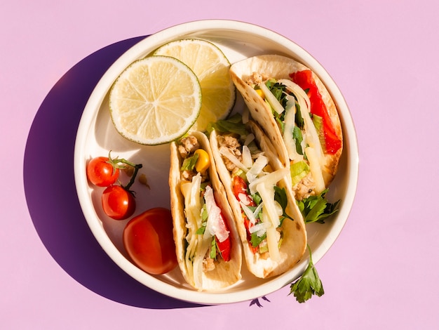 Flat lay arrangement with delicious food on purple background