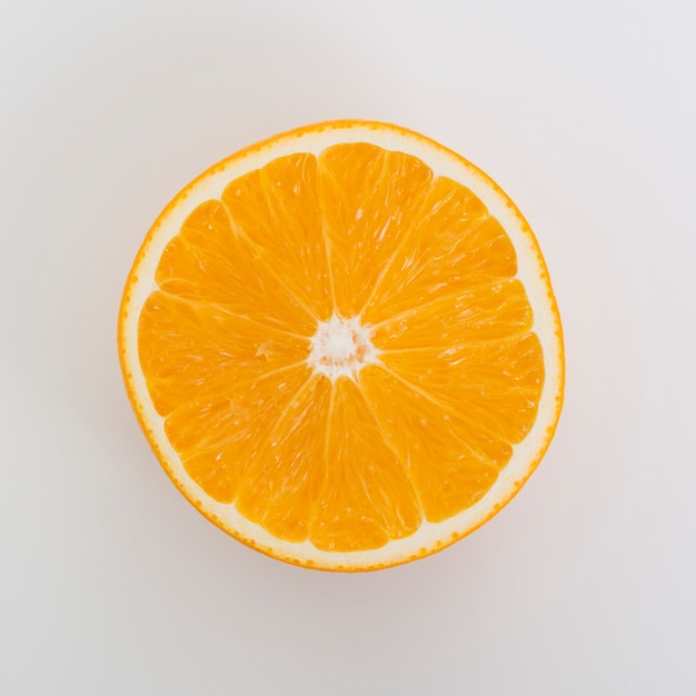 Free Photo flat lay arrangement with half orange on white background