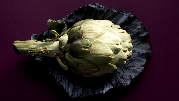 Free Photo flat lay of artichoke on cabbage leaf