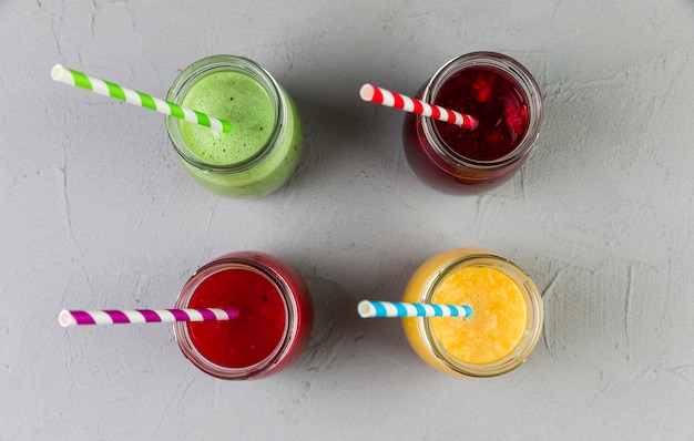 Free photo flat lay assorted smoothie glasses