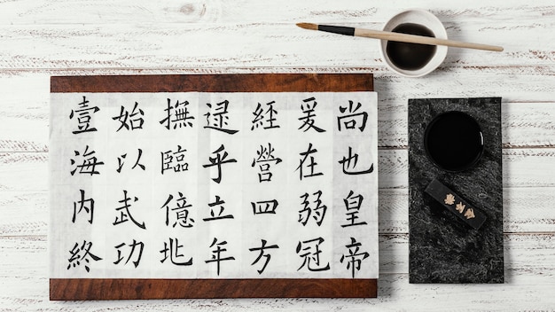 Free Photo flat lay assortment of chinese symbols written with ink