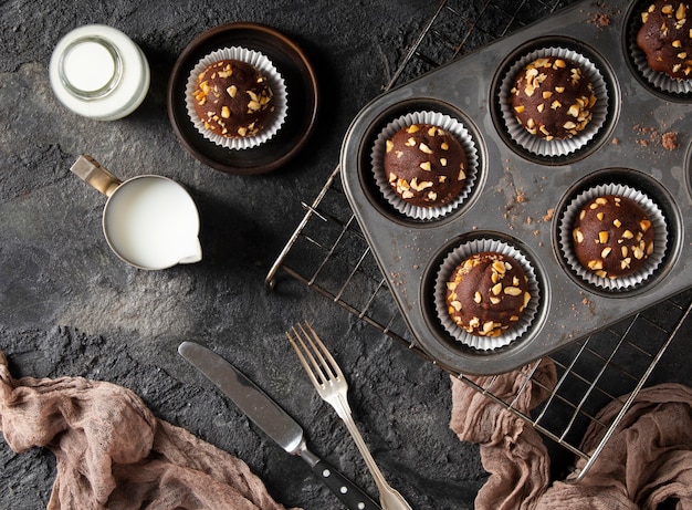 Free Photo flat lay assortment of chocolate cupcakes