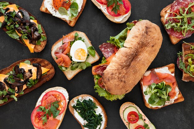 Free Photo flat lay assortment of delicious sandwiches