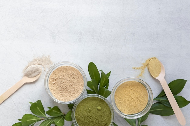 Flat lay assortment of sand and leaves