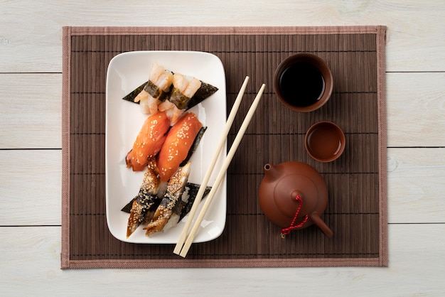 Free photo flat lay assortment of sushi goodies