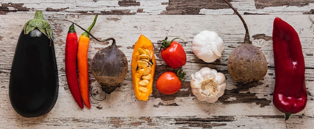 Flat lay assortment of veggies and tomatoes