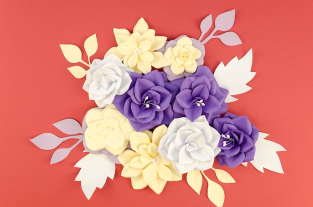 Free Photo flat lay assortment with paper flowers and red background