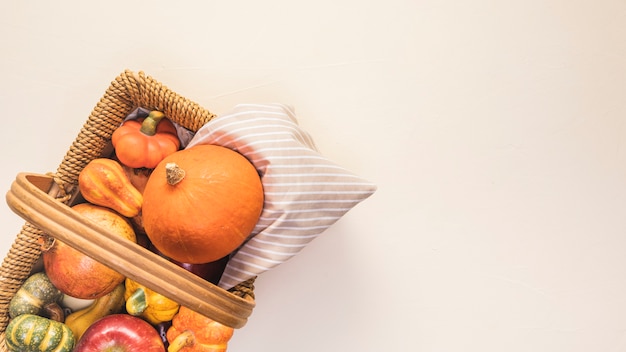 Flat lay autumn food in picnic basket