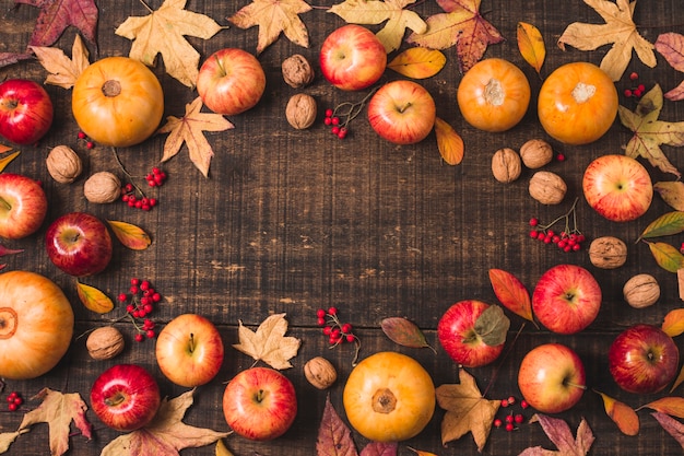 Free Photo flat lay autumn leaves and fruit frame