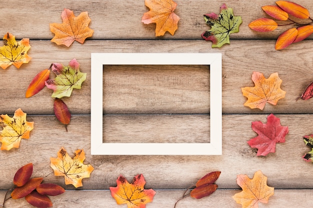 Free Photo flat lay autumn leaves with copy space