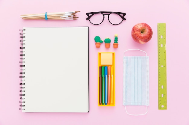 Free Photo flat lay of back to school materials with notebook and pencils