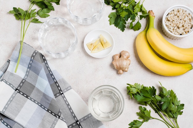 Free Photo flat lay of banana and ginger with lemon