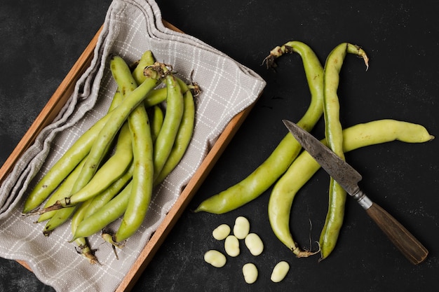 Free Photo flat lay of beans in basket with garlic