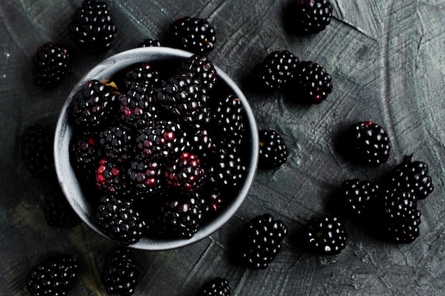 Flat lay black forest fruits in bowl