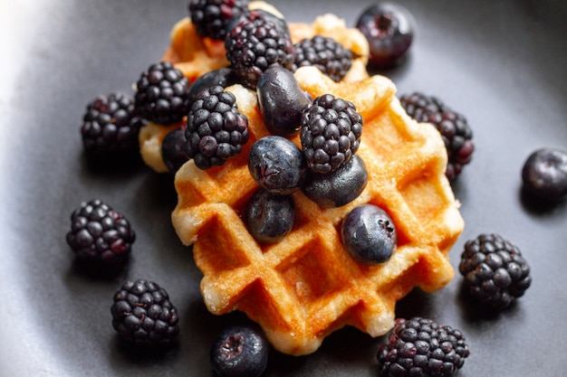 Free Photo flat lay black forest fruits on waffles