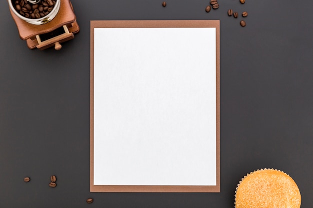 Flat lay of blank menu paper with coffee beans and bun