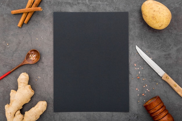 Flat lay of blank menu paper with potato and ginger