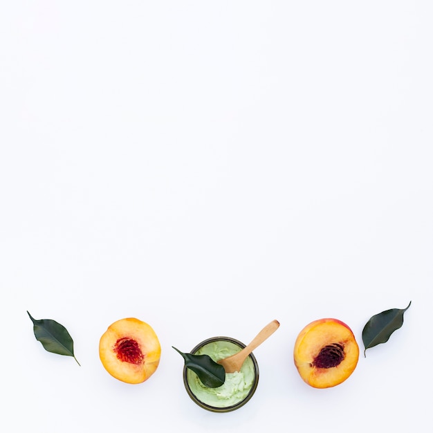 Free photo flat lay of body butter and nectarines with copy space