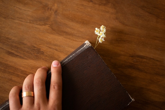 Flat lay book with flower bookmark