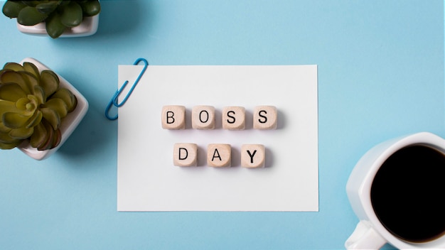 Free photo flat lay boss's day arrangement on blue background