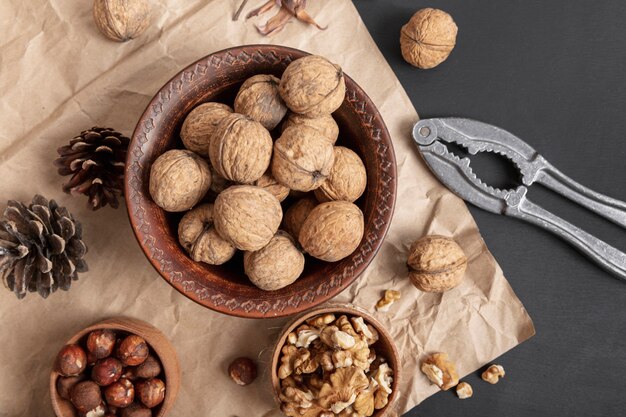 Flat lay of bowl with walnuts and hazelnuts