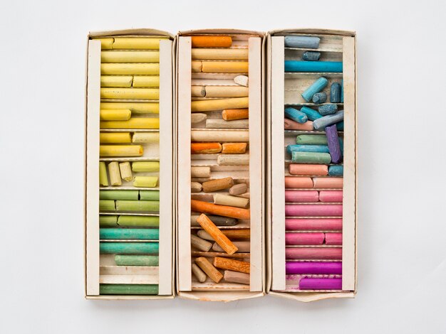 Flat lay of box with colorful chalk