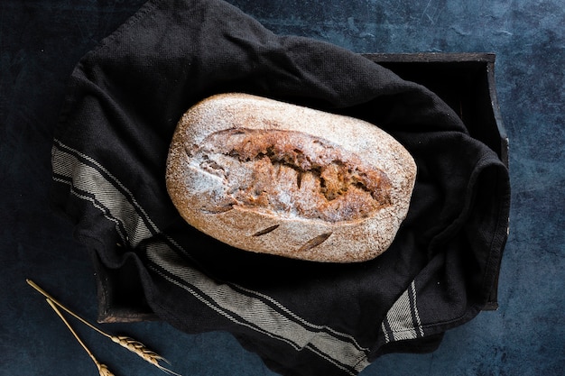 Free photo flat lay of bread on black cloth