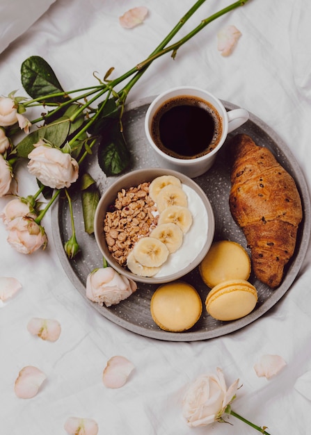 Free photo flat lay of breakfast bowl with cereal and macarons