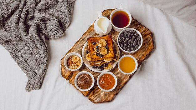 Flat lay of breakfast toast with blueberries and banana