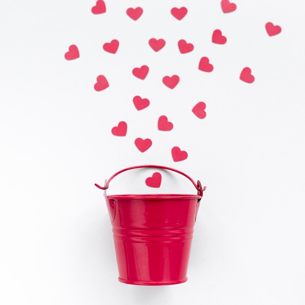 Flat lay of bucket with hearts